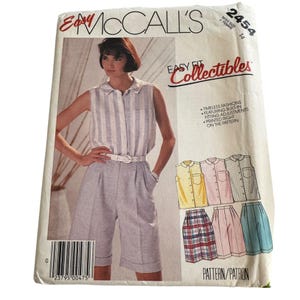 May include: A vintage McCall's sewing pattern packet featuring a woman in a sleeveless striped shirt and shorts. The packet includes the text "Easy Fit Collectibles" and "Timeless Fashions". The pattern number is 2454, size 14.