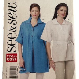 May include: A vintage sewing pattern titled "See & Sew" with the number B5481. The pattern features two women modeling different styles of tunics. One is a short-sleeved blue tunic, and the other is a short-sleeved white tunic with a tie waist.