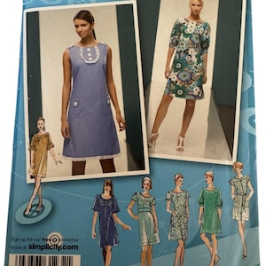 May include: A sewing pattern package featuring dress designs. The package includes images of dresses in various styles and colors, including a blue polka-dot dress and a floral print dress. The package also includes the text "RUNWAY" and "Simplicity.com".
