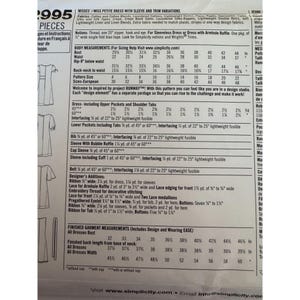 May include: A Simplicity sewing pattern envelope back featuring technical specifications for a dress with sleeve and trim variations. The white paper includes black text detailing fabric requirements, body measurements in inches, and notions.