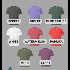 May include: Colour chart showing different t-shirt colours. The colours are: Pepper, Violet, Blue Spruce, White, Watermelon, Paprika, Moss, and Berry. The text "TYPEONE DESIGNS" is at the bottom of the image.