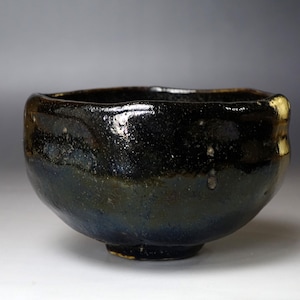 1st Nakamura Donen (1876-1937) Handcrafted Black Raku Tea Bowl with Iridescent Glaze and Wabi-Sabi Aesthetic