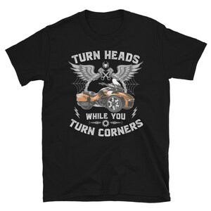 May include: Black t-shirt with a graphic of a motorcycle and the text "Turn Heads While You Turn Corners".