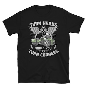 May include: Black t-shirt with a white graphic of a green motorcycle with the text "Turn Heads While You Turn Corners".