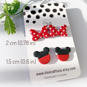 May include: Red and black polymer clay earrings with a Mickey Mouse design. The earrings are 2 cm (0.78 inches) long and 1.5 cm (0.6 inches) wide. The earrings are handmade in Canada. www.tinicraftsco.etsy.com