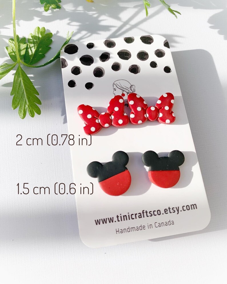 May include: Red and black polymer clay earrings with a Mickey Mouse design. The earrings are 2 cm (0.78 inches) long and 1.5 cm (0.6 inches) wide. The earrings are handmade in Canada. www.tinicraftsco.etsy.com