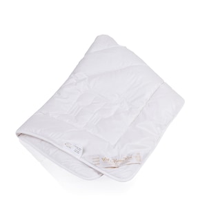 May include: White quilted duvet insert with a white label that says "Mama's Nest" in gold lettering.