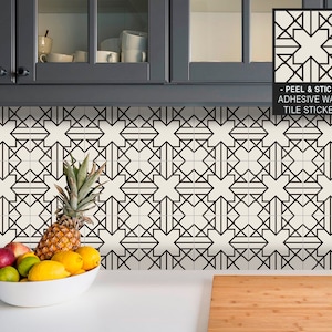 May include: Black and white geometric peel and stick tile stickers for a kitchen backsplash. The stickers are arranged in a repeating pattern of stars and squares. The text "Peel & Stick - Adhesive Wall Tile Sticker" is visible in the image.