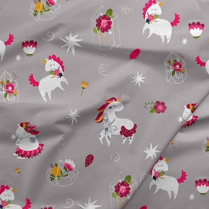 May include: A grey fabric with a repeating pattern of white unicorns, pink flowers, and crystal-like shapes. The unicorns have pink manes and tails and are adorned with flowers. The crystals are filled with pink and green flowers.
