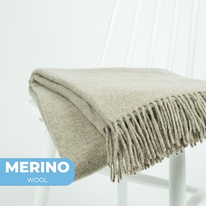 Cozy light brown merino wool blend blanket with fringed edges in a solid weave by NAMO