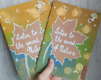 Handmade notebook with a painted Kraft paper cover. Mini notebook with a natural motif, a gift idea for a friend, a travel journal.