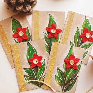 Biglietto di Natale formato A6, busta inclusa. Cartolina di auguri decorata con fiore in stoffa, illustrazione dipinta a mano, nastro dorato