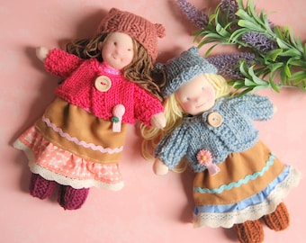 Handmade Waldorf Steiner-inspired soft toy. Children's doll with a set of clothes, an original birthday or Christmas gift.
