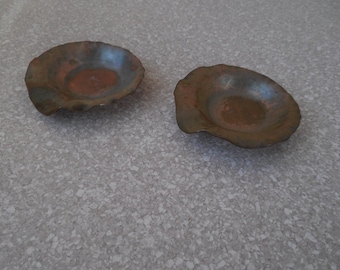 Two Arts and Crafts hammered copper ashtrays marked from the Avon Metal Company