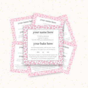 May include: Pink business card with a floral border and the text "your name here", "17 cherry tree lane", "Landon England", "123-456-7890 yourwebsitehere.com", "your bake here", "homemade bakes with known food allergens, included but not limited to: dairy, soy, nuts", "This food is made in a home kitchen and is not inspected by the Department of State Health Services or a local health department."