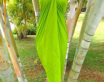 May include: A bright green halter top made of a soft, stretchy fabric. The top is tied at the neck and has a loose, flowing fit.