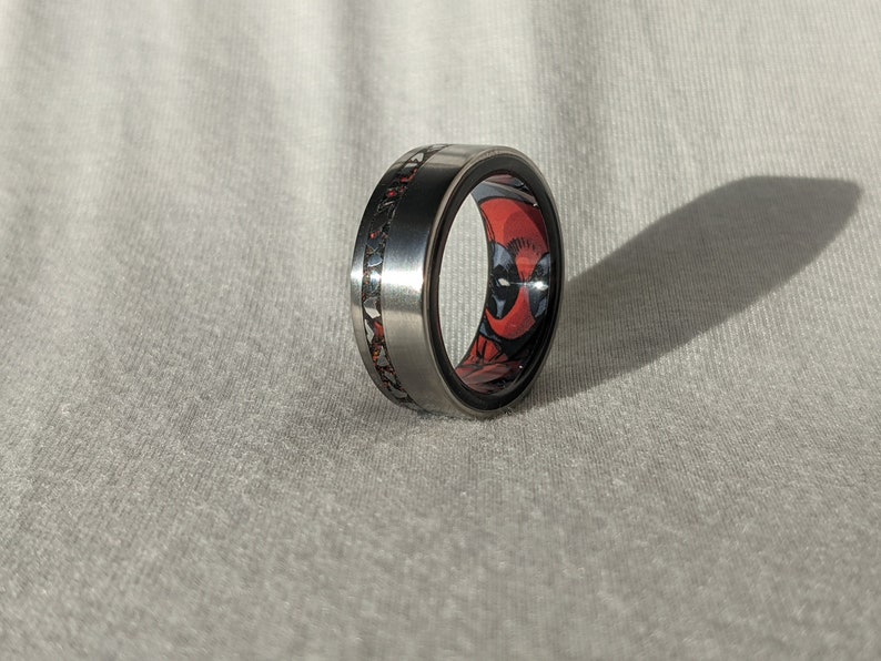 Brushed Titanium & Ebony wood Ring with Meteorite, Obsidian and Red Opal inlay and Deadpool Comic Book Secret Identity Liner Bentwood image 1