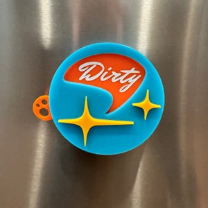 May include: A blue and orange round magnet with the word "Dirty" in white lettering and two yellow stars.