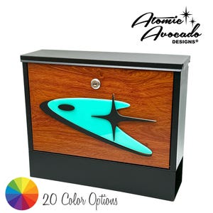 May include: A retro-style mailbox with a woodgrain finish and a turquoise and black atomic-inspired design. The mailbox has a black metal frame and a slot for mail. The text "Atomic Avocado Designs" is visible in the top right corner of the image.