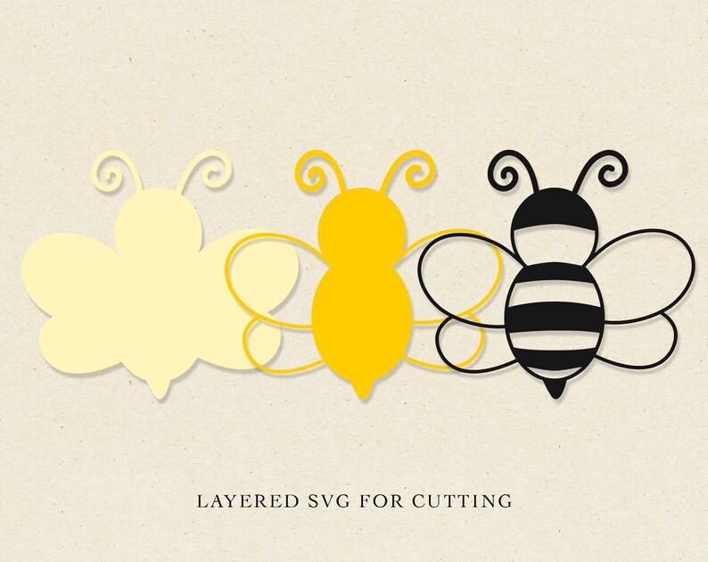 May include: Layered SVG cut file design of three bees. The first bee is yellow, the second bee is yellow with black outlines, and the third bee is black and white with black outlines. The text "LAYERED SVG FOR CUTTING" is at the bottom of the image.