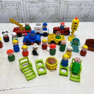 May include: A collection of vintage Little People toys, including a fire truck, mail truck, car, and a variety of figures. The toys are made of plastic and are in good condition.