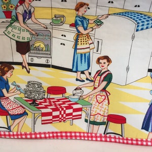 May include: A colorful illustration of five women in a kitchen, wearing aprons and preparing food. The kitchen features a yellow and white checkered floor, white cabinets, and a red and white checkered tablecloth on a table.