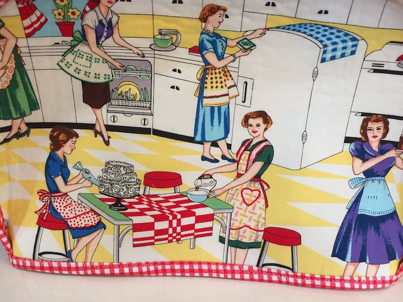 May include: A colorful illustration of five women in a kitchen, wearing aprons and preparing food. The kitchen features a yellow and white checkered floor, white cabinets, and a red and white checkered tablecloth on a table.