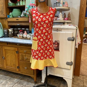 C. Women’s lady&#39;s apron, with ruffle and pocket, vintage or retro style, full length, red & yellow floral, gingham, thirties, forties style