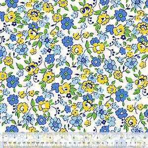 May include: White fabric with a repeating floral pattern of blue and yellow flowers and green leaves. The flowers are small and scattered across the fabric. A ruler is at the bottom of the image.