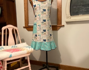 C. Women’s lady's apron, vintage farmstead, vintage style, full length with ruffle and pocket, sheep, alpaca, chicken, bees, windmill