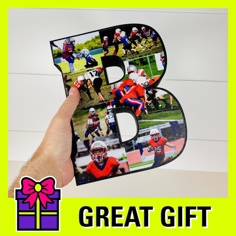May include: A black wooden letter B with a collage of photos of children playing football. The letter is being held by a hand. The text "GREAT GIFT" is printed below the letter.