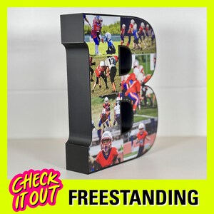 May include: Black freestanding letter B with a collage of photos of children playing football. The photos are arranged in a grid pattern and are printed on the front of the letter.