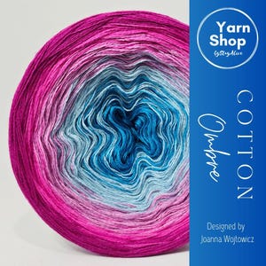 May include: A round ball of ombre cotton yarn in shades of pink, blue, and teal. The yarn is labeled "Cotton Ombre" and "Yarn Shop by StayAlive". Designed by Joanna Wojtowicz.