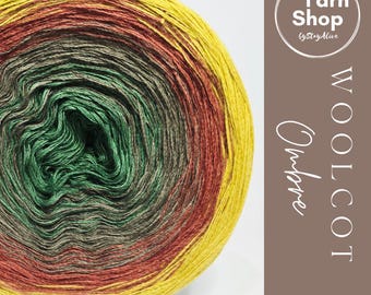 May include: A vibrant ball of yarn with an ombre effect, transitioning from yellow to red, green, and brown. The yarn is labeled "WOOLCOT Ombre" with a "Yarn Shop" logo. Ideal for knitting and crochet projects.
