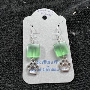 Green and silver paw print earrings