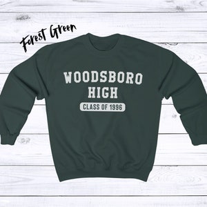 May include: Forest green sweatshirt with white text that reads "Woodsboro High Class of 1996".