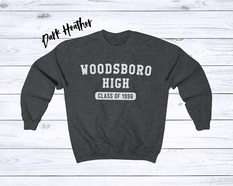 May include: Dark heather grey sweatshirt with the text "WOODSBORO HIGH CLASS OF 1996" in white.