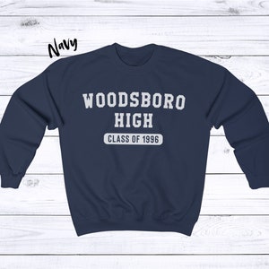 May include: Navy blue sweatshirt with white text that reads "Woodsboro High Class of 1996".