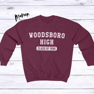 May include: Maroon sweatshirt with white text that reads "Woodsboro High Class of 1996".