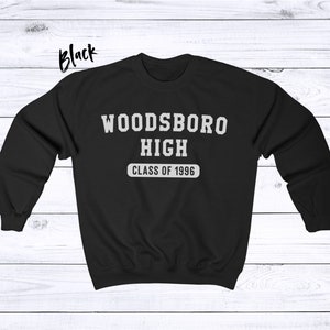 May include: Black sweatshirt with white text that reads "Woodsboro High Class of 1996".