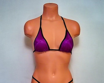 May include: Purple mesh bikini top with black trim. The top has a halter style with adjustable straps.