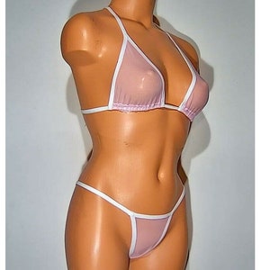 May include: A pink and white sheer mesh bikini top and bottom. The top is a triangle style with a halter neck strap. The bottom is a cheeky style with a low rise.