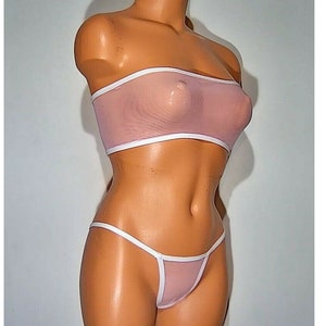 May include: A pink mesh bandeau top and matching panty set with white trim. The set is made of a sheer, stretchy fabric.