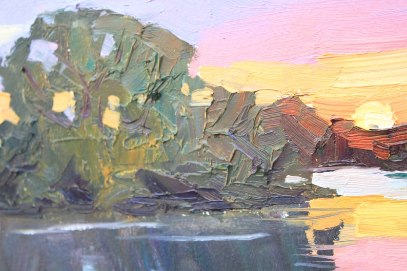 May include: Impressionistic oil painting of a landscape with a body of water reflecting the sky. The sky transitions from pink to yellow, suggesting a sunrise or sunset. Green and brown brushstrokes depict trees and land.