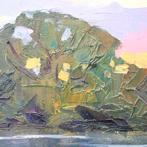 May include: Impasto oil painting of a landscape with a tree and water. The tree is rendered in shades of green and brown, with yellow highlights. The sky transitions from pink to yellow and white. The water is a dark gray.