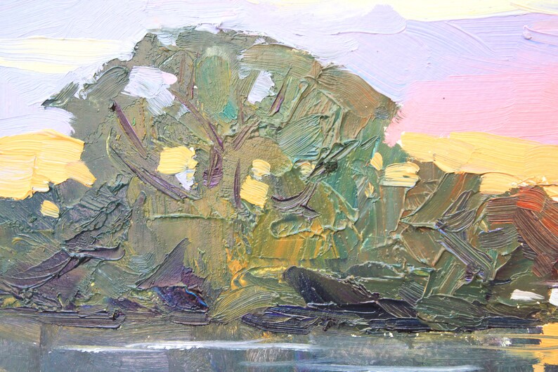 May include: Impasto oil painting of a landscape with a tree and water. The tree is rendered in shades of green and brown, with yellow highlights. The sky transitions from pink to yellow and white. The water is a dark gray.