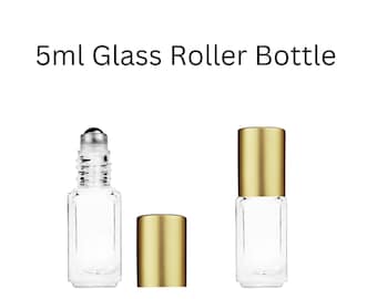 May include: Two clear glass roller bottles with gold caps. The bottles are 5 ml in size.