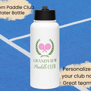 May include: White water bottle with a green wreath and pink paddle rackets. The text "GRANDVIEW Paddle CLUB" is printed on the bottle.  Personalize with your club name - Great team gift!