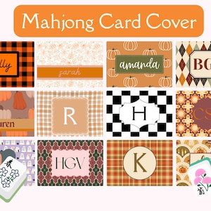May include: A collection of twelve rectangular Mahjong card covers featuring various patterns including orange and black buffalo plaid, pumpkins, geometric shapes, and ghosts. Each cover displays a personalized name or monogram in a central frame.