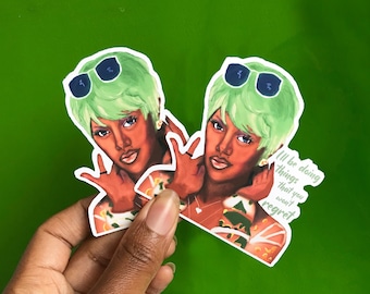 May include: Two stickers featuring a woman with green hair wearing sunglasses. The woman is making a hand gesture. The text on the sticker reads "I'll be doing things that you won't regret."
